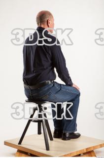 Sitting pose blue deep shirt jeans of Ed 0004